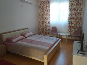 Ein Bett oder Betten in einem Zimmer der Unterkunft Apartment and room Panorama
