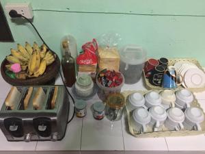 a table with a bunch of food and drinks at Romantic Time Mountain Resort in Pai