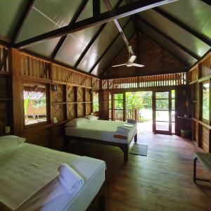 Кровать или кровати в номере Our Jungle House