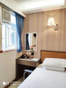 A bed or beds in a room at Celltronik Hostel 先創旅店