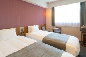 Postel nebo postele na pokoji v ubytování M's Hotel Kyoto Station Taruya