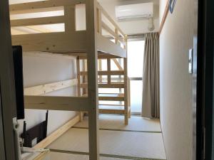 Palanda nebo palandy na pokoji v ubytování Hotel Mirai
