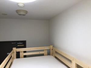 Postel nebo postele na pokoji v ubytování Hotel Mirai