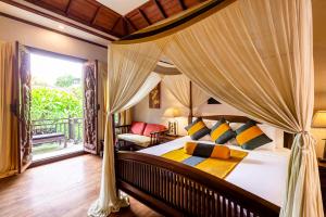 Un pat sau paturi într-o cameră la Amata Lanna Chiang Mai, One Member of the Secret Retreats