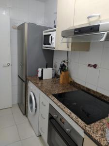 Una cocina o zona de cocina en Apartamento primera línea de mar