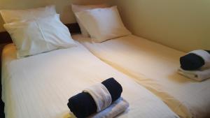 A bed or beds in a room at Botel Sailing Home