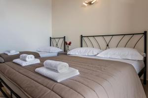 Postel nebo postele na pokoji v ubytování Anesis Hotel
