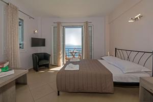Postel nebo postele na pokoji v ubytování Anesis Hotel