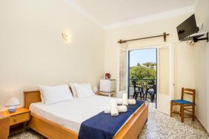 Postel nebo postele na pokoji v ubytování Alinda Hotel