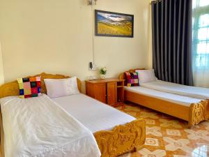 Ένα ή περισσότερα κρεβάτια σε δωμάτιο στο Thien Phuong Guesthouse