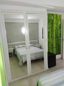 Cama o camas de una habitación en Apartamento primera línea de mar