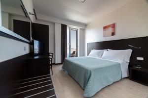 Postel nebo postele na pokoji v ubytování Alisei Palace Hotel