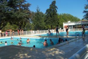 a group of people in a swimming pool at Camping le Moulin du Roy in Revel