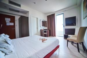 TV a/nebo společenská místnost v ubytování Alisei Palace Hotel