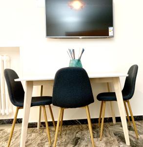 A television and/or entertainment centre at Indipendenza Luxury Apartments