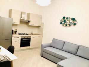 A kitchen or kitchenette at Indipendenza Luxury Apartments