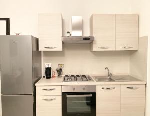 A kitchen or kitchenette at Indipendenza Luxury Apartments