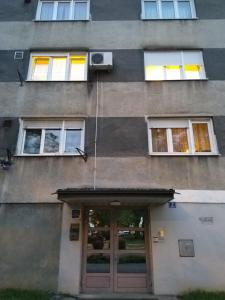 a building with a door and several windows at Studio APARTMAN TVRTKO in Varaždin