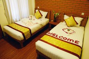 Llit o llits en una habitació de A Little Bit of BAGAN HOTEL
