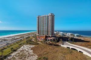 an aerial view of a tall building next to the beach at Portofino Tower 1-903 Beachfront Sunset Views in Pensacola Beach