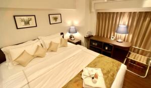 Postel nebo postele na pokoji v ubytování Le Tour Hotel Akihabara Ekimae 楽途ホテル秋葉原駅前店