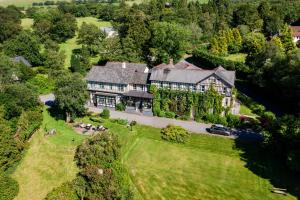 an aerial view of a large house with a yard at The Lake Country House Hotel & Spa in Llangammarch Wells