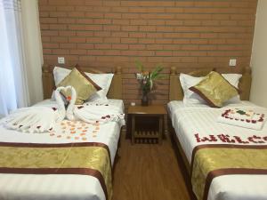 Llit o llits en una habitació de A Little Bit of BAGAN HOTEL