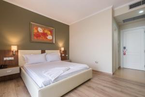 Postel nebo postele na pokoji v ubytování KEIT Hotel