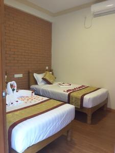 Llit o llits en una habitació de A Little Bit of BAGAN HOTEL