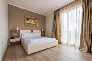 Postel nebo postele na pokoji v ubytování KEIT Hotel