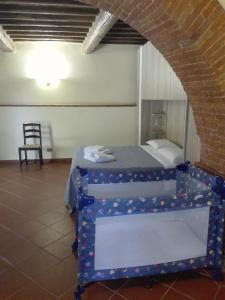 Postel nebo postele na pokoji v ubytování Il Tasso