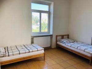 Ένα ή περισσότερα κρεβάτια σε δωμάτιο στο Apartmány Dubická