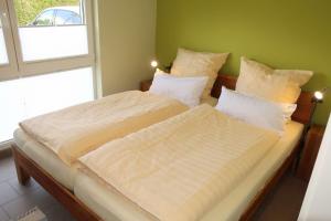 Postel nebo postele na pokoji v ubytování Ferienhaus Noor und Meer