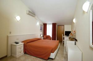 Postel nebo postele na pokoji v ubytování Hotel Massimino