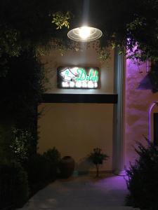 a neon sign on the side of a building at Sapanca Dilek Konagi Hotel in Sapanca