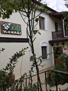 a building with a sign on the side of it at Sapanca Dilek Konagi Hotel in Sapanca