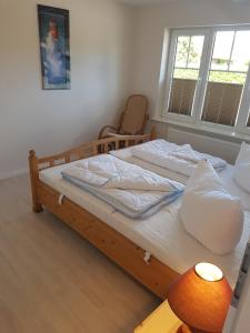 Säng eller sängar i ett rum på Wohnung "Flügge"