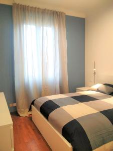 A bed or beds in a room at Carlos BCS2 - Sanremo Center Suite -