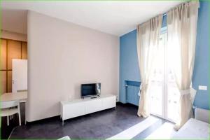 A television and/or entertainment centre at Carlos BCS2 - Sanremo Center Suite -