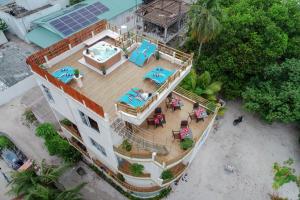 an overhead view of a house on the beach at Vilu Thari Inn Maldives in Mahibadhoo