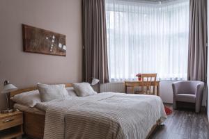 Posteľ alebo postele v izbe v ubytovaní TATRYSTAY Apartmány Lomnica