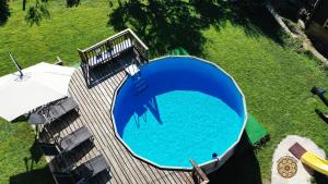 an overhead view of a large blue swimming pool at Chalet Hutsulyandiya in Mykulychyn