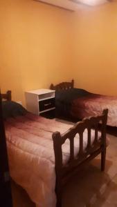 Postel nebo postele na pokoji v ubytování Apart El Árbol