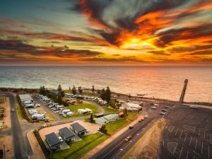 an aerial view of a parking lot next to the ocean at BIG4 Port Hughes Holiday Park in Port Hughes