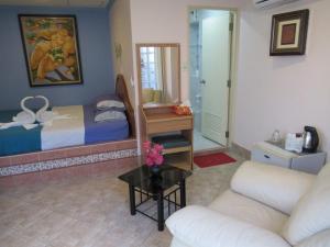 Postel nebo postele na pokoji v ubytování Villa Oranje Pattaya
