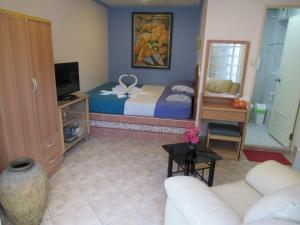 Postel nebo postele na pokoji v ubytování Villa Oranje Pattaya