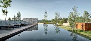 Bazén v ubytování De Capoc Resort nebo v jeho okolí