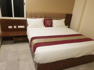 Postel nebo postele na pokoji v ubytování Durga residency