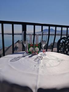 a table topped with a bottle of wine at Berg en Zee Guesthouse in Gordonʼs Bay