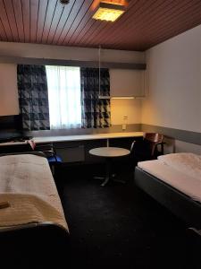 Giường trong phòng chung tại Lyngen Fjordhotell